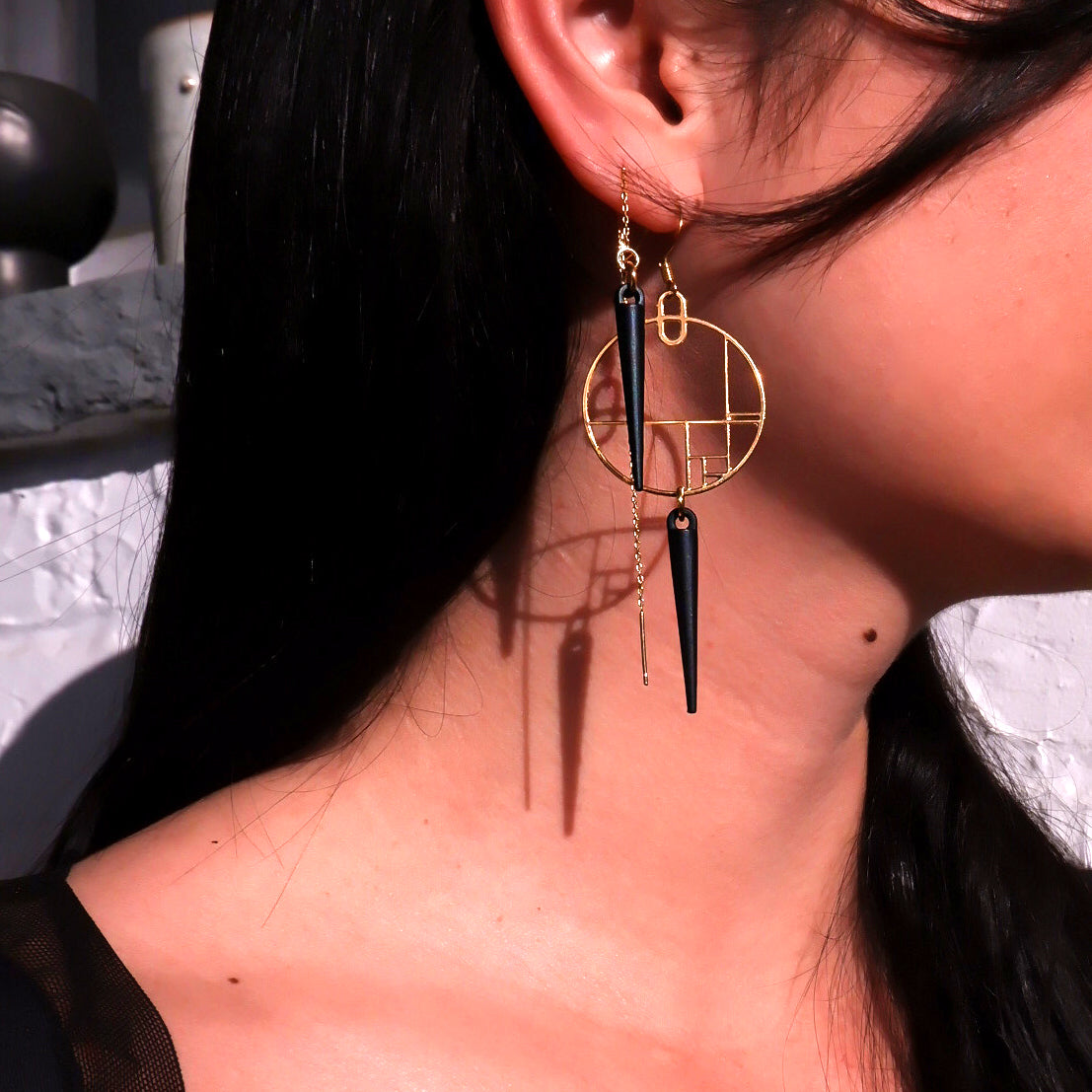 modern art style earrings with spikes